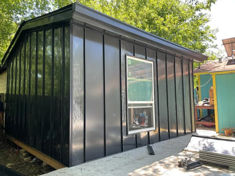 Black standing seam metal wall panels for Roof Inspection in Pecan Grove