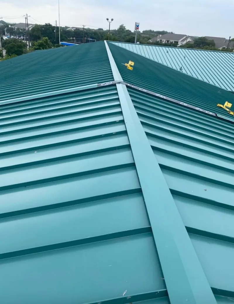 Green commercial metal roof ridge and valley for Metal Roof Repair in Pecan Grove